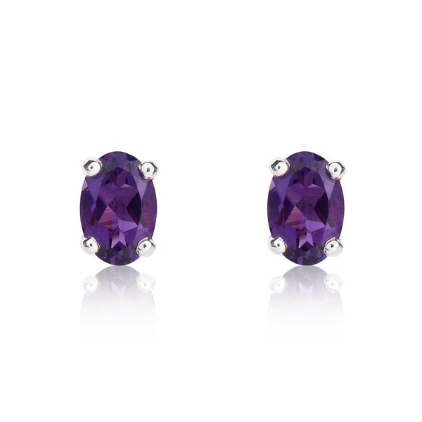 9ct White Gold Amethyst 6x4mm Oval Claw Set Stud Earrings. 33-51-035.
